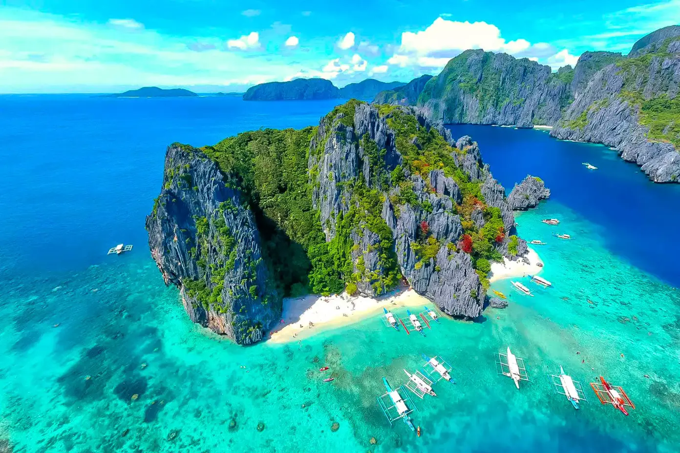 a large island with boats in the water